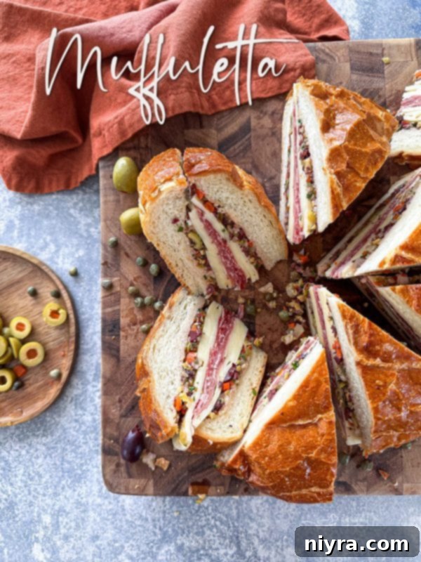 New Orleans Iconic Muffuletta 15 The final, beautifully sliced Muffuletta sandwich