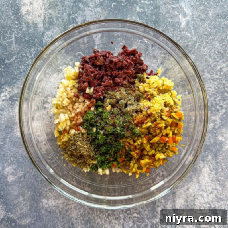 New Orleans Iconic Muffuletta 8 Preparing the olive dressing for Muffuletta