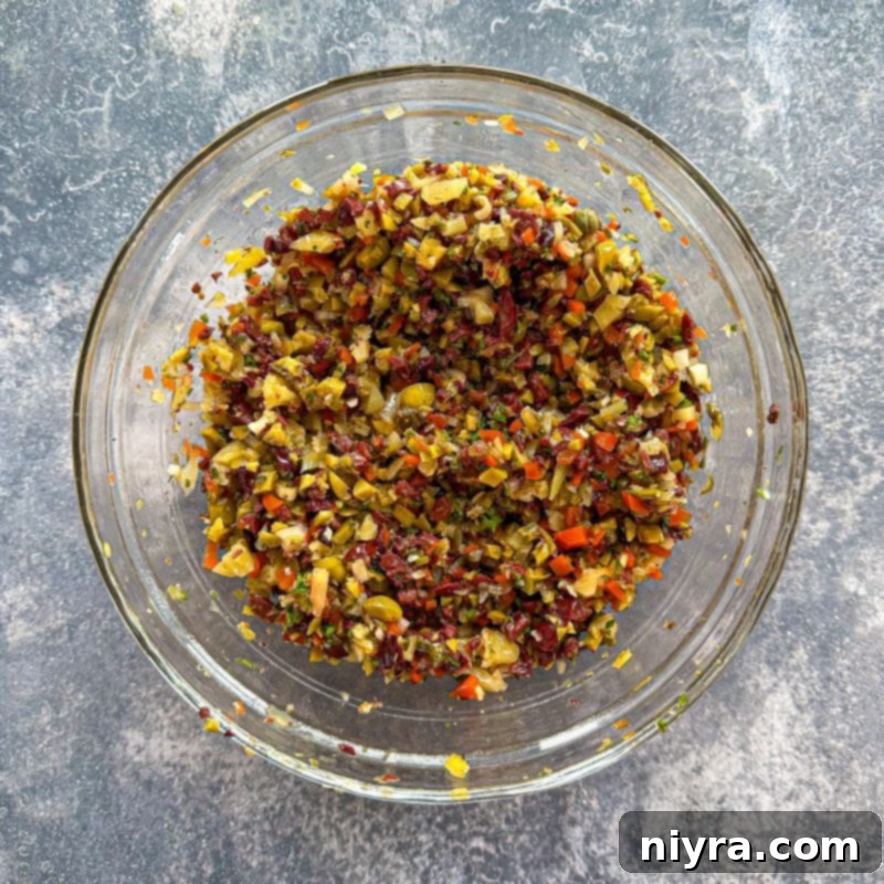 New Orleans Iconic Muffuletta 9 Olive dressing marinating in a bowl