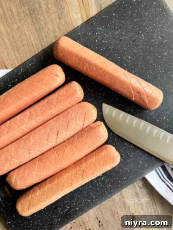 Smoky Dogs with Zesty Kraut 11 Close-up of a hot dog with shallow crosshatch cuts