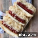 Smoky Dogs with Zesty Kraut 23 Smoked Hot Dogs & Kraut in buns on a serving plate