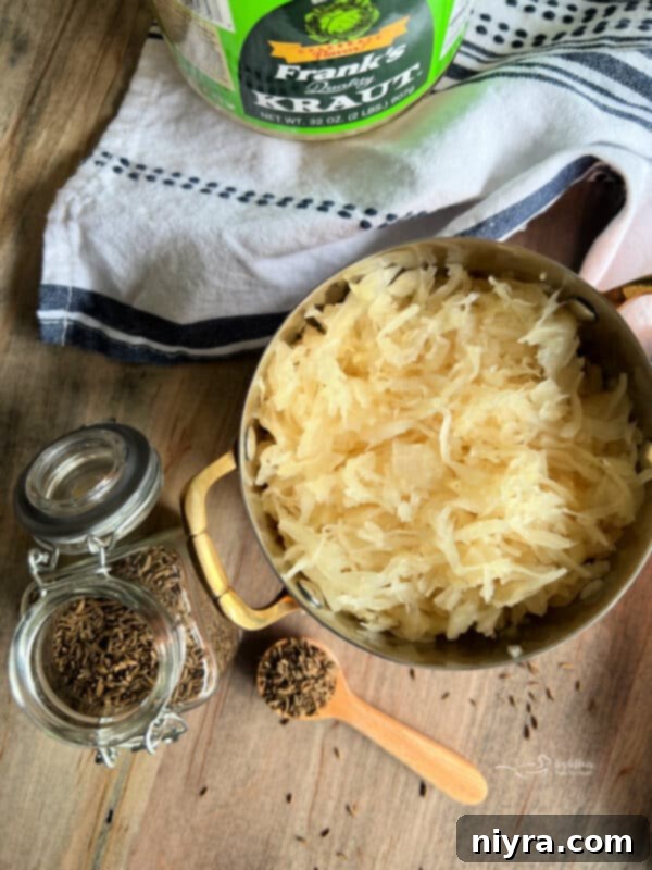 Smoky Dogs with Zesty Kraut 7 Two smoked hot dogs in buns with kraut, on a wooden board