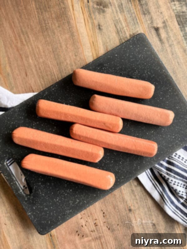 Smoky Dogs with Zesty Kraut 9 Smoked hot dogs and kraut on a tray, ready to be served