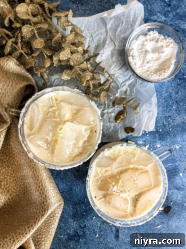 White Russian Cocktail with gold decorations blue background