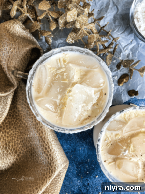 White Russian Cocktail close up on blue background