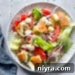 Little King Salad on a scalloped plate