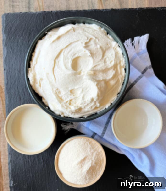 Close-up of the smooth, creamy texture of the vanilla almond fruit dip in a mixing bowl, showcasing its readiness for serving.