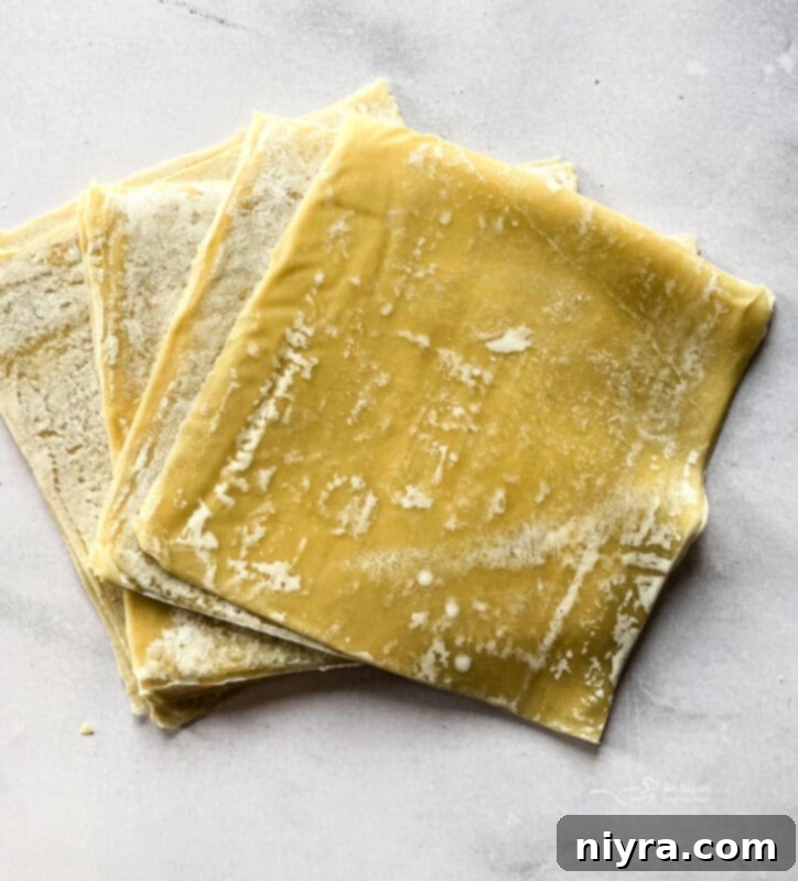 Close up of apple pie filling in egg roll wrapper