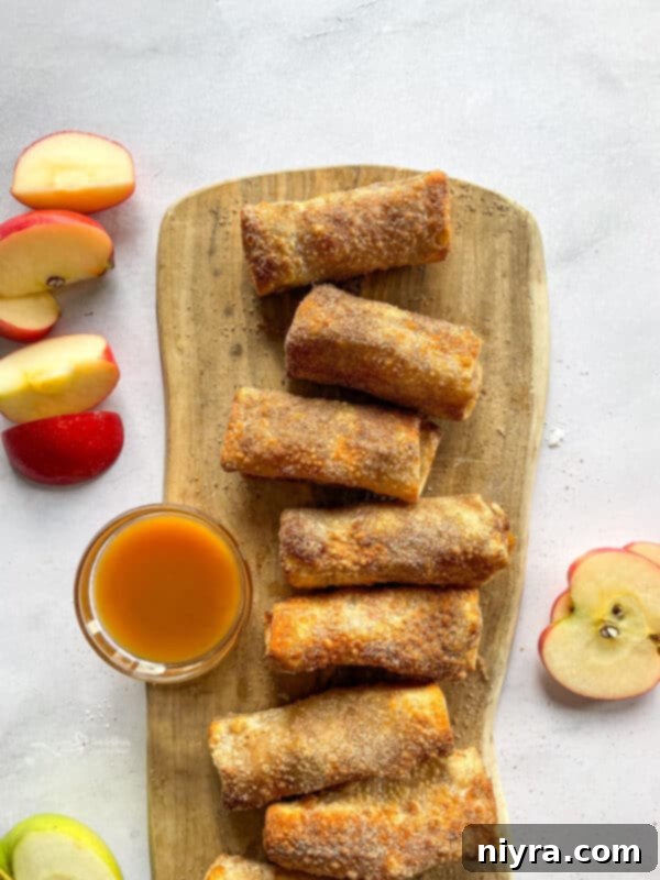 Finished apple pie egg rolls on a platter