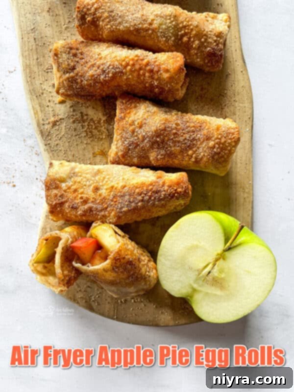 Hero image of Air Fryer Apple Pie Egg Rolls on a cooling rack