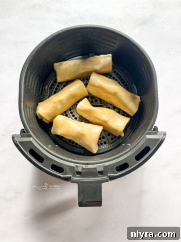 Partially folded apple pie egg roll