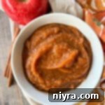 Instant Pot Pumpkin Applesauce in a white bowl.