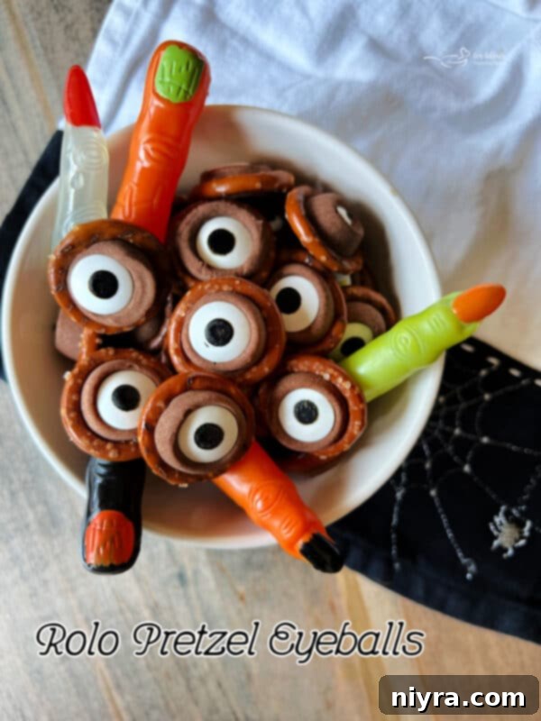 Rolo Pretzel Eyeballs with plastic witches fingers