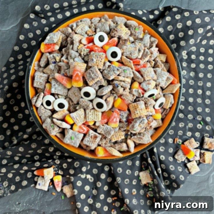 Overhead of Halloween Double Peanut Butter Muddy Buddies in a halloween bowl