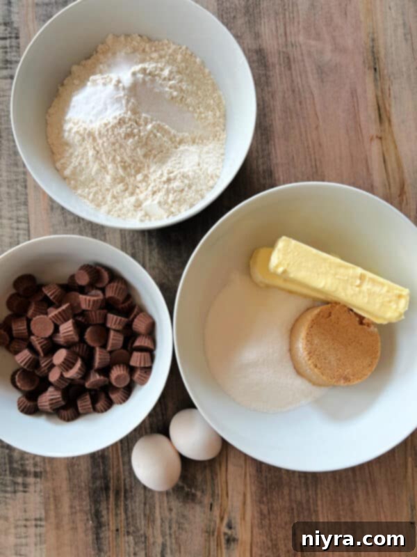 Ingredients for Reese's Peanut Butter Cup Cookies laid out on a kitchen counter.
