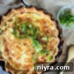 Overhead of bacon & swiss quiche in a pie dish