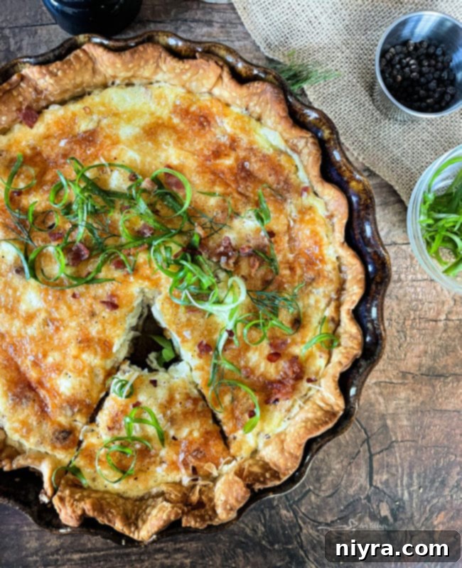 A beautifully baked Bacon and Swiss Quiche, golden brown and ready to be served.