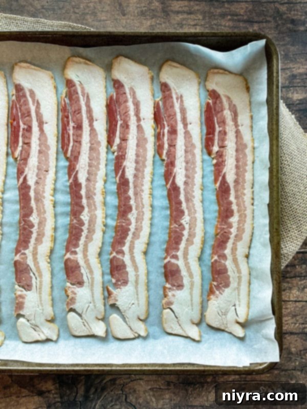 Ingredients for Bacon and Swiss Quiche laid out, including bacon, Swiss cheese, and onions.