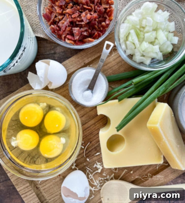 A golden brown Bacon & Swiss Quiche in a pie dish, with a slice already removed.