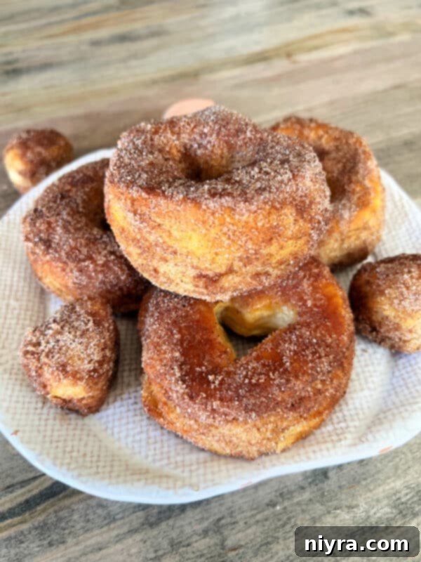 Stacked Pumpkin Spice Air Fryer Biscuit Donuts ready to be served for breakfast