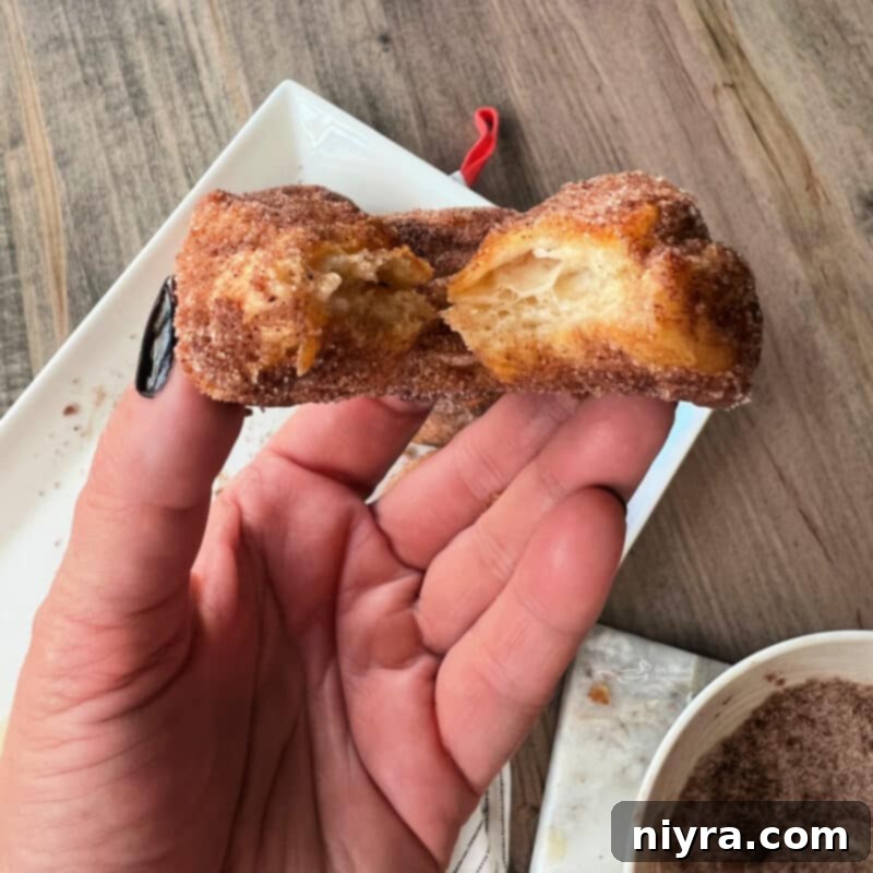 A selection of warm Pumpkin Spice Air Fryer Biscuit Donuts presented beautifully