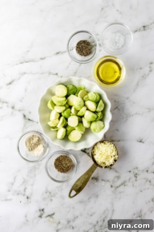 Ingredients for air fryer Brussels sprouts laid out on a cutting board: fresh Brussels sprouts, olive oil, and various spices.