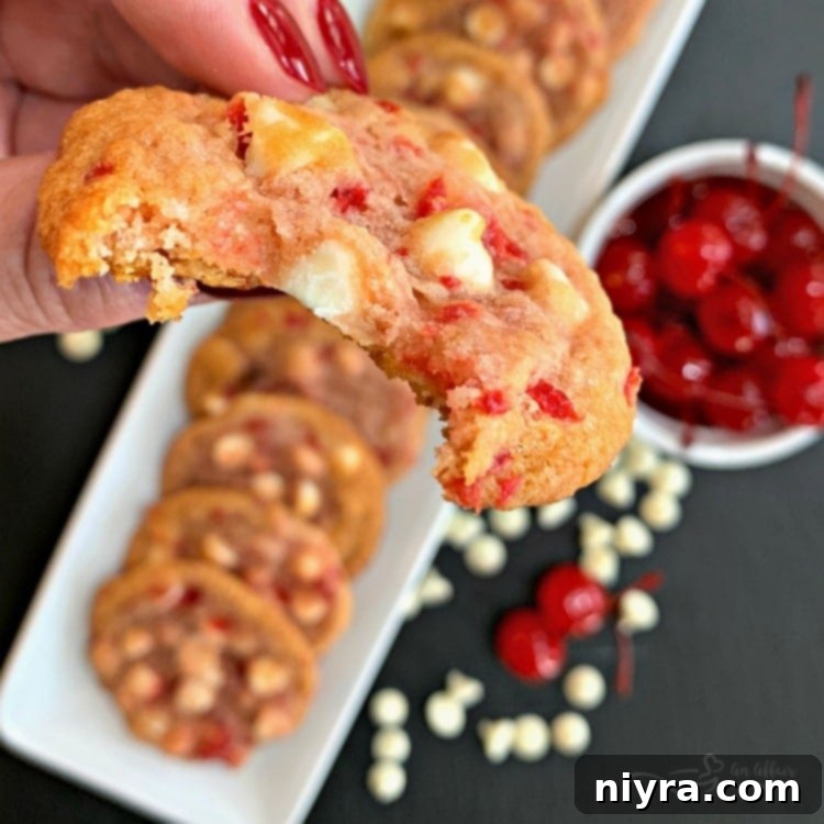 Close up of a bite out of a White Chocolate Cherry Cookies