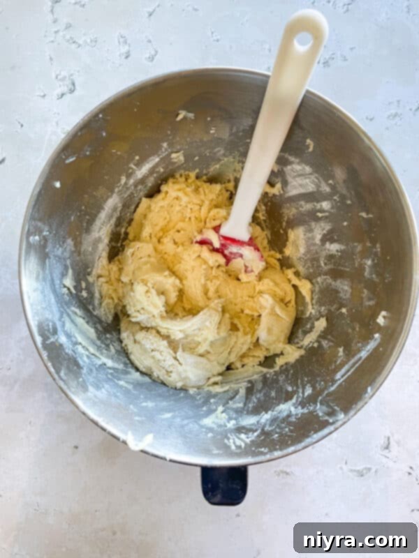 The initial mixing of sugar and shortening for the cookie dough.