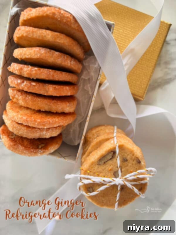 Delicious Orange Ginger Refrigerator Cookies cooling on a wire rack with a festive background.