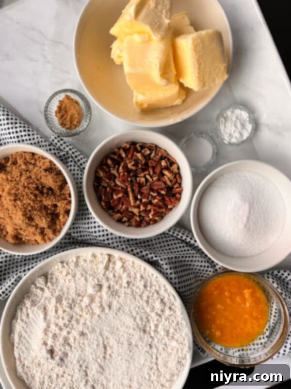 A vibrant pile of freshly baked Orange Ginger Refrigerator Cookies, dusted with sparkling decorator sugar.