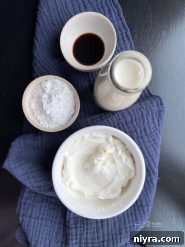 Crafting Perfect Homemade Devonshire Cream 3 Devonshire Cream in a small blue bowl with a gold spoon