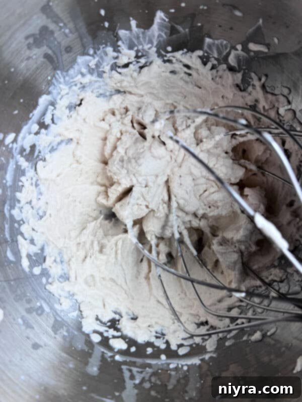 Crafting Perfect Homemade Devonshire Cream 5 Folding sour cream into whipped cream