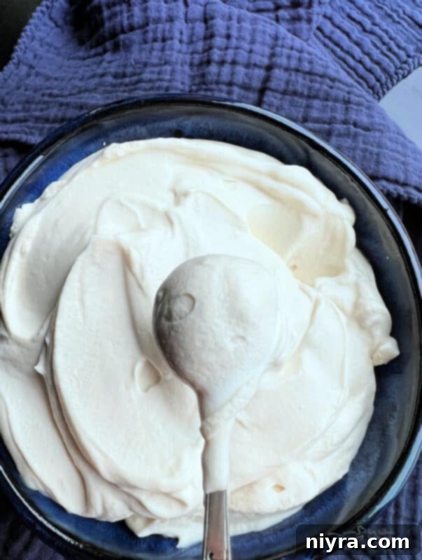 Crafting Perfect Homemade Devonshire Cream 8 Close-up of Devonshire Cream in a small blue bowl