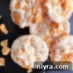 Cornflake crispy cookies close up on a dark background.