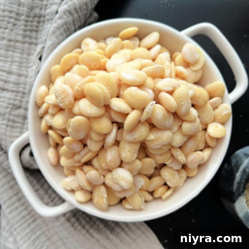 Grandmas Hearty Instant Pot Ham and Bean Soup 10 Lima beans in a strainer after soaking, ready for use