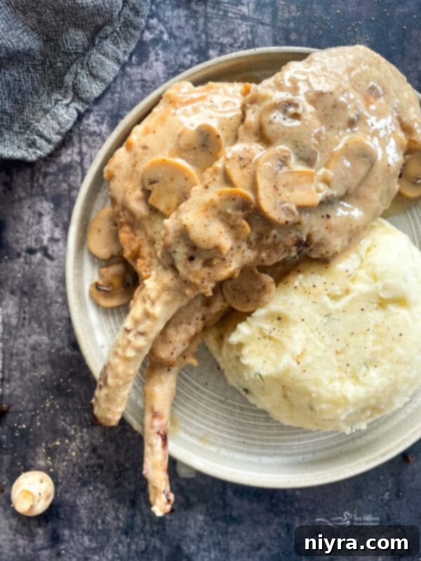 Grandmas Hearty Instant Pot Ham and Bean Soup 17 Pork Chops with Mushroom Gravy, served on a plate with mashed potatoes