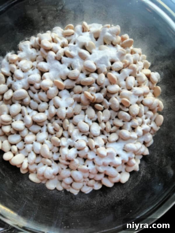 Grandmas Hearty Instant Pot Ham and Bean Soup 9 Lima beans and baking powder in a dish, starting the soaking process