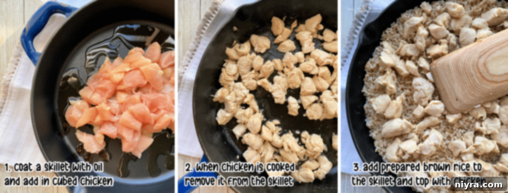 Cooking cubed chicken in a cast iron skillet with sesame oil