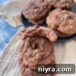 Bailey’s Chocolate Chip Cookies are a boozy twist on the classic cookie. Chewy chocolate cookies, with Bailey’s Irish Cream mixed in.