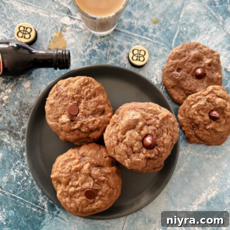 Plate of Bailey's Chocolate Chip Cookies with a glass of Irish Cream