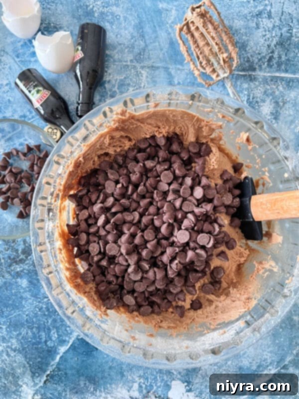 Folding chocolate chips into the Bailey's cookie dough