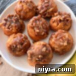 Banana Pecan Roll recipe - on white plate with bananas alongside