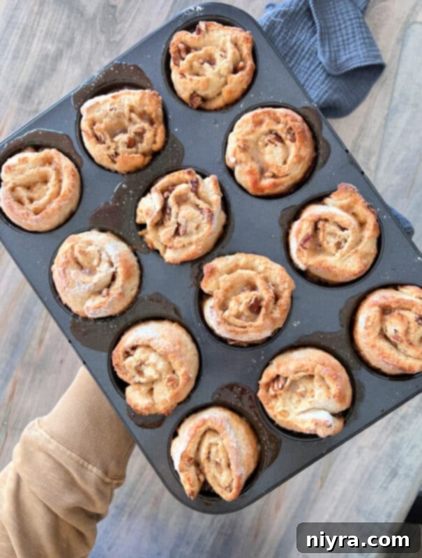 Sliced banana pecan rolls placed in muffin tin cups