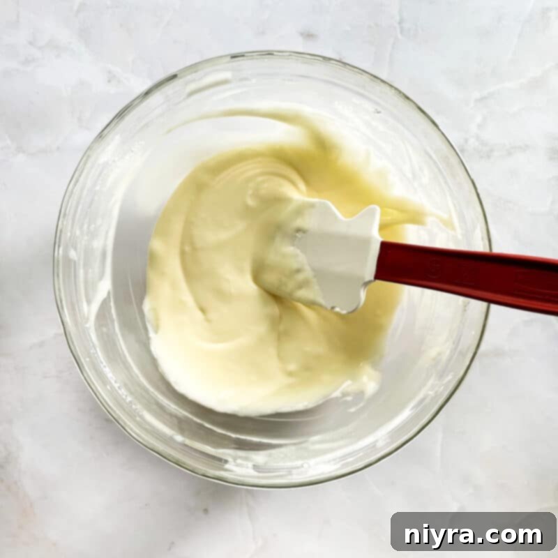 Ingredients for toaster strudel glaze being whisked in a bowl.