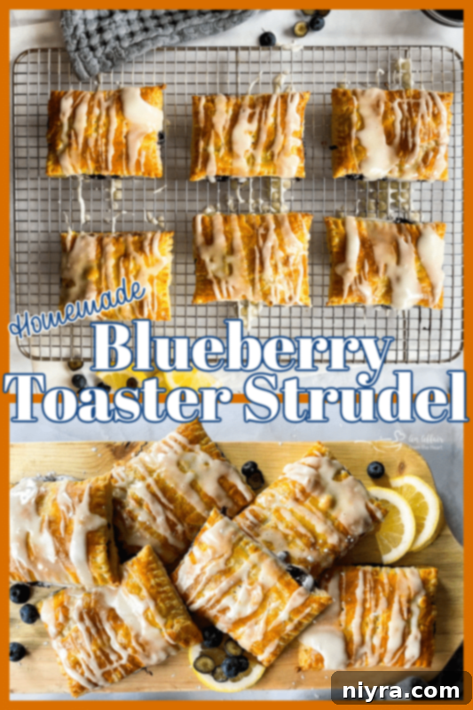 Homemade Blueberry Toaster Strudel on a cutting board, with a bite taken out.