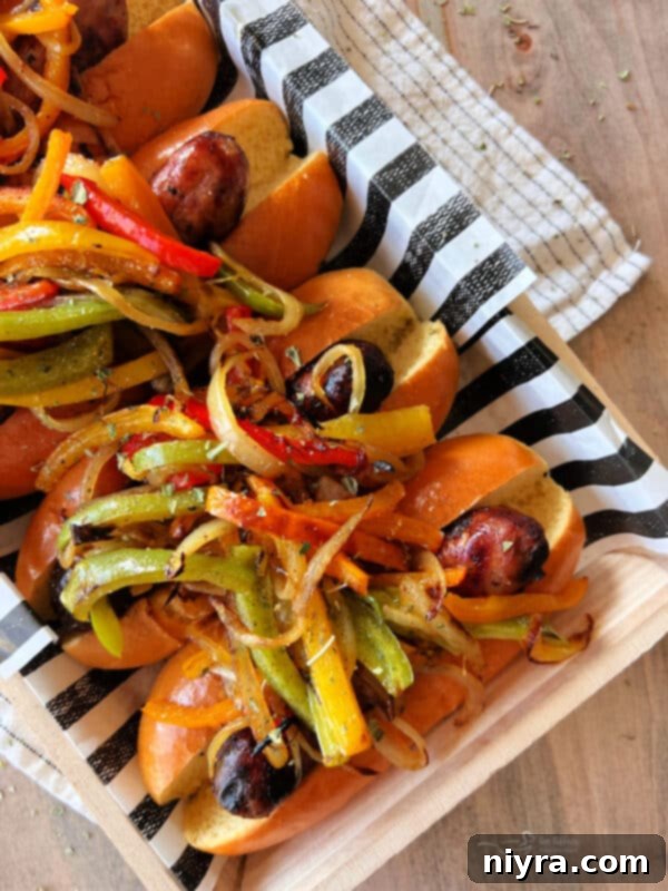 Grilled Italian Sausages with Peppers and Onions on a plate