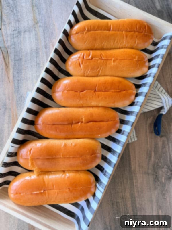 Assembling a sausage and peppers sandwich