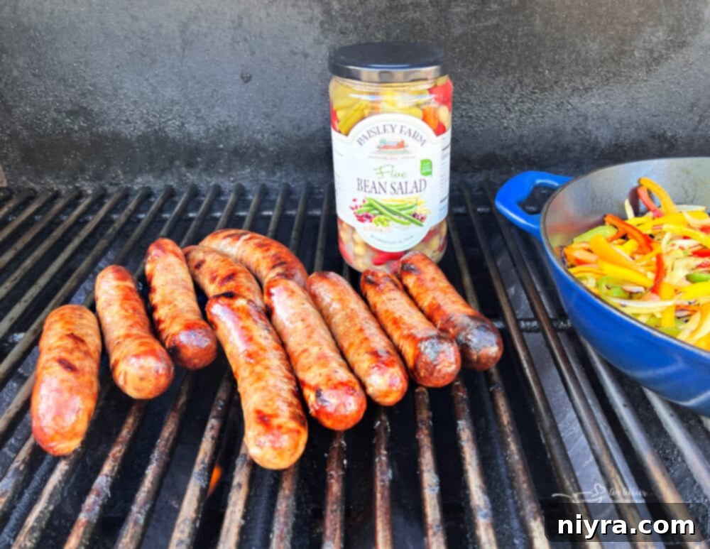 Sausages grilling on an outdoor barbecue