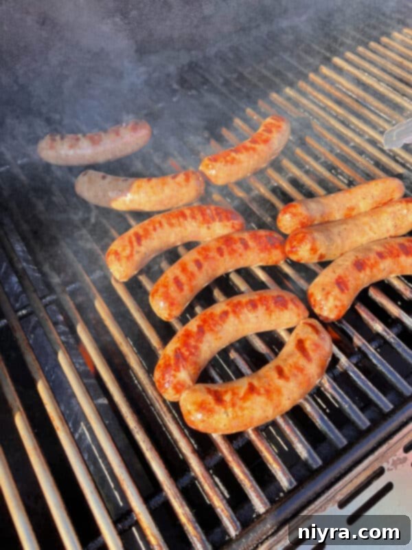Peppers and Onions cooking in a cast iron skillet on the grill