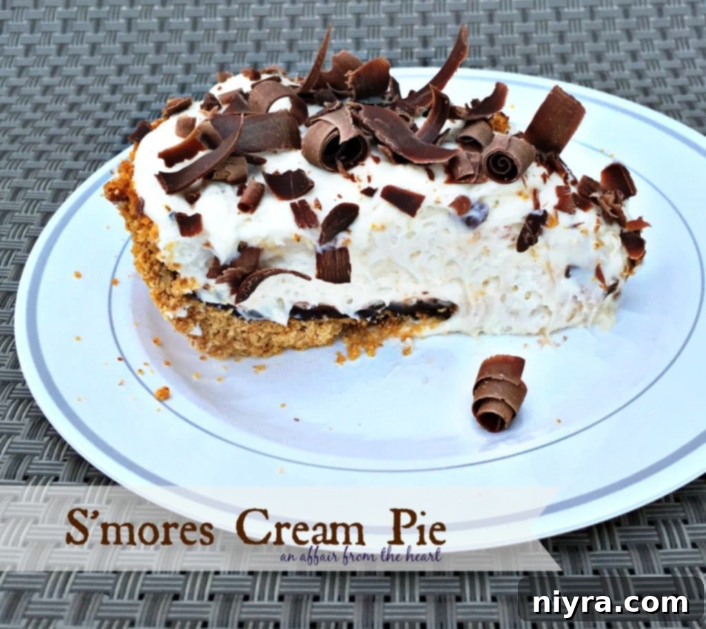 Close-up of S'mores Cream Pie showing layers of crust, chocolate, and marshmallow cream
